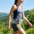 Portable waist fan in use while hiking outdoors (batch1 lifestyle)